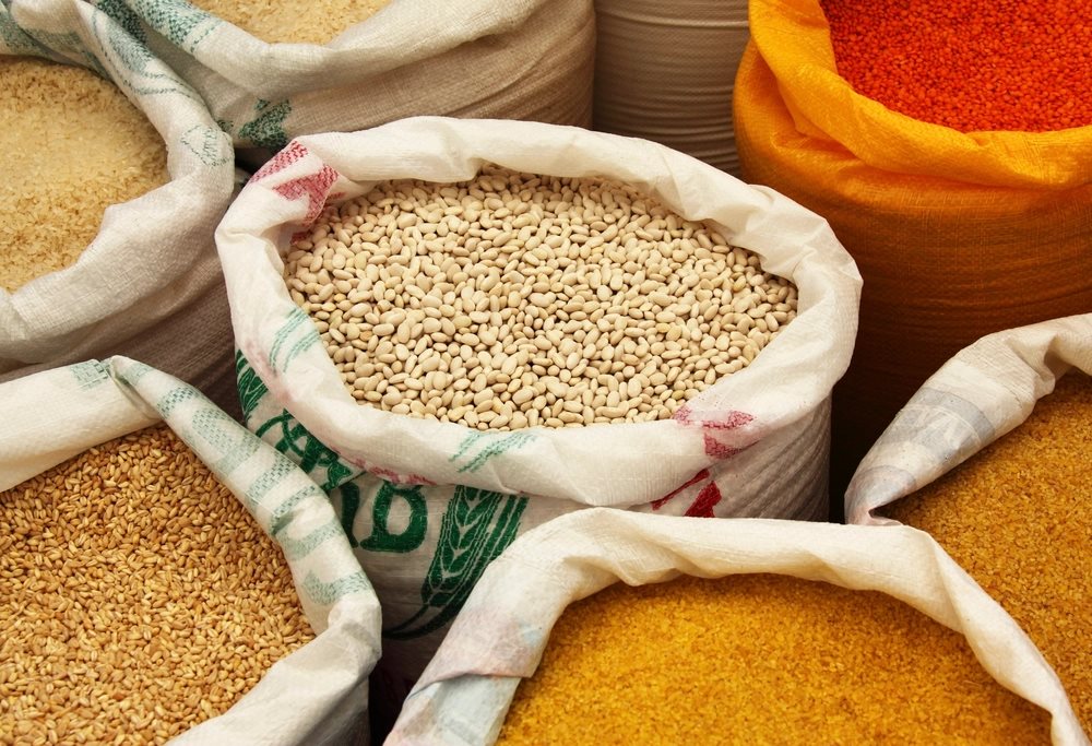 Indian spices and dried goods displayed in bulk at a sourcing market
