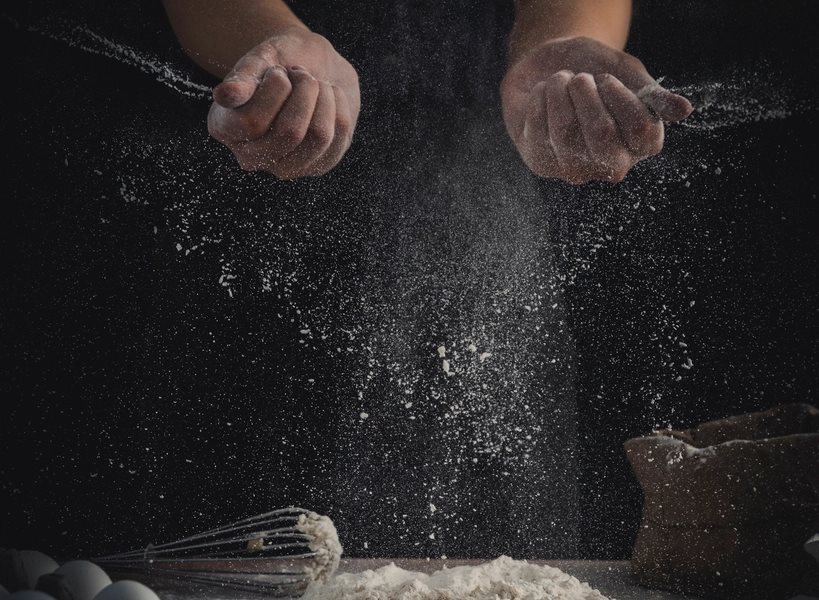 Indian flour being worked by hand on a preparation surface